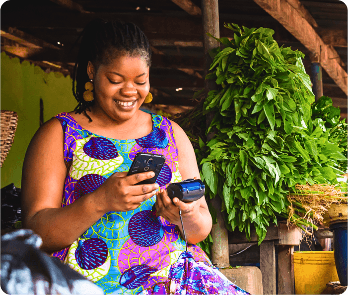 Smiling Mighty Finance customer using her phone